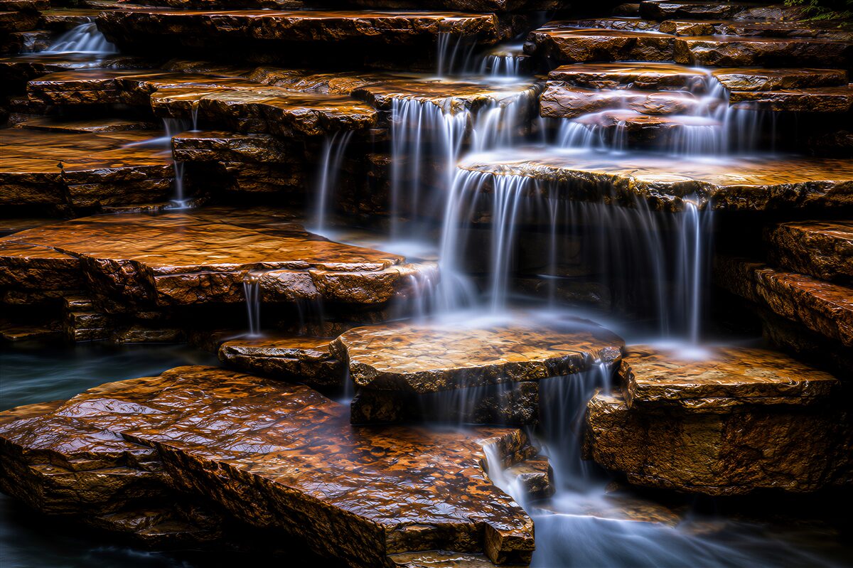 Fotobehang waterval cascade met stenen