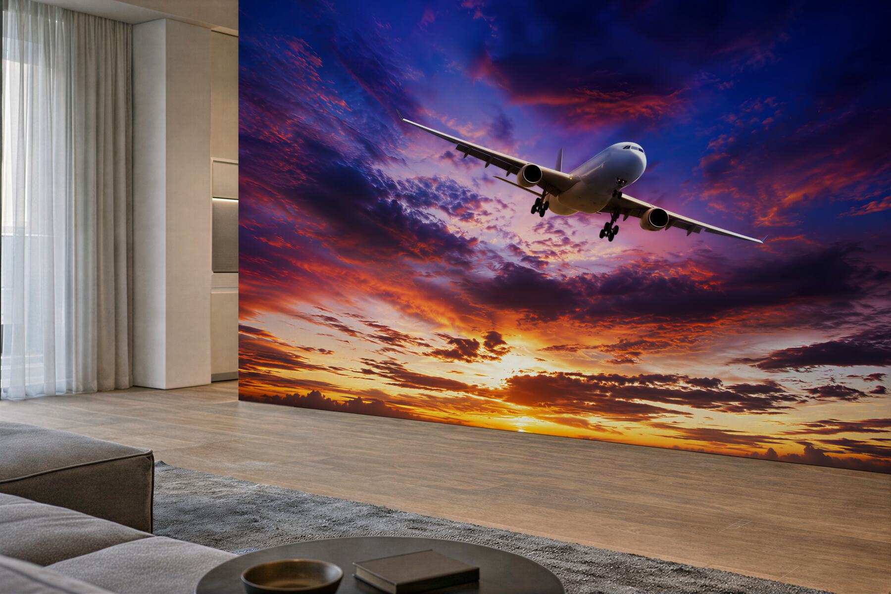 Fotobehang vliegend vliegtuig tegen een zonsonderganglucht