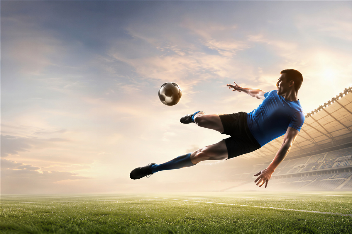 Fotobehang voetballer in de lucht in het stadion dynamisch voor de tienerkamer