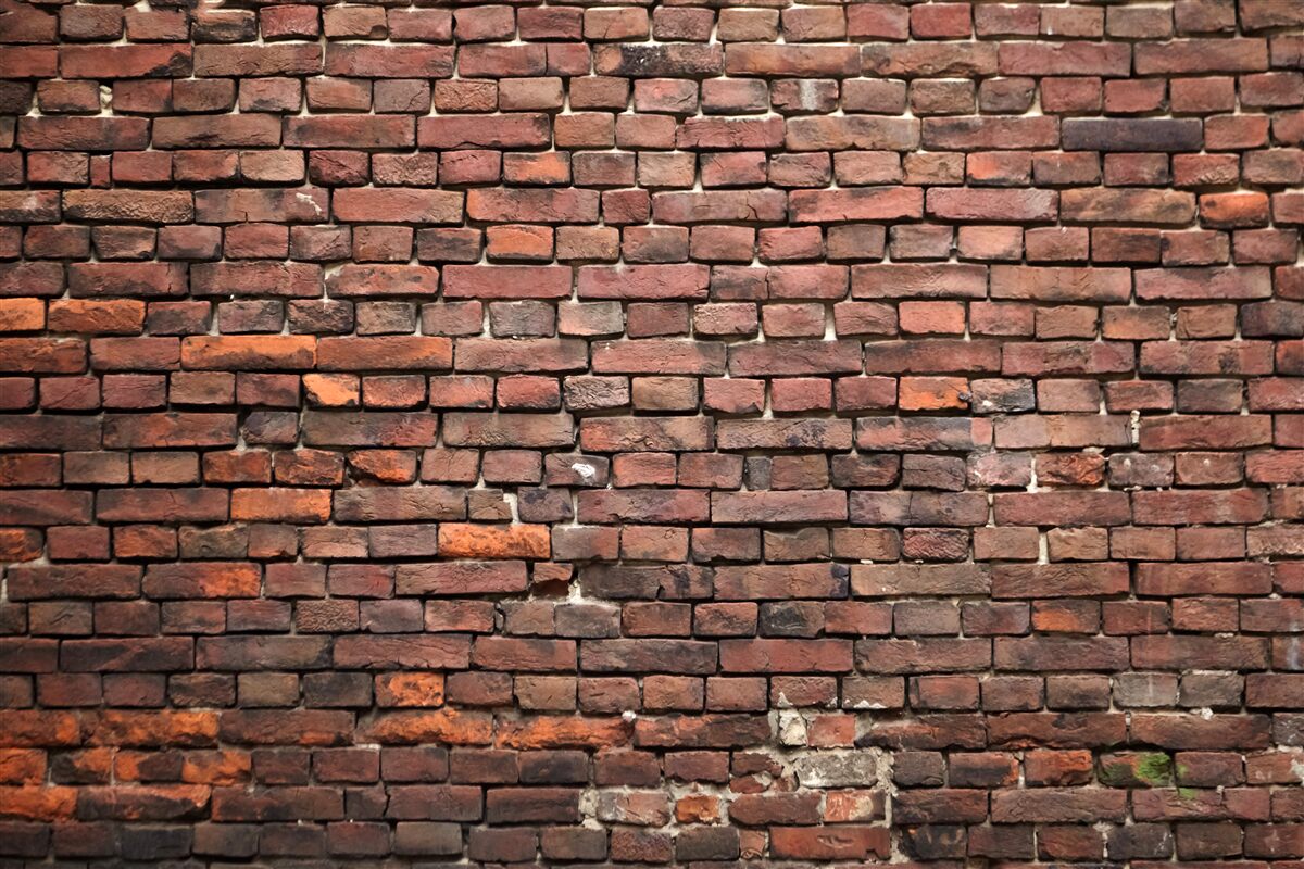 Fotobehang oude donkere bakstenen muur
