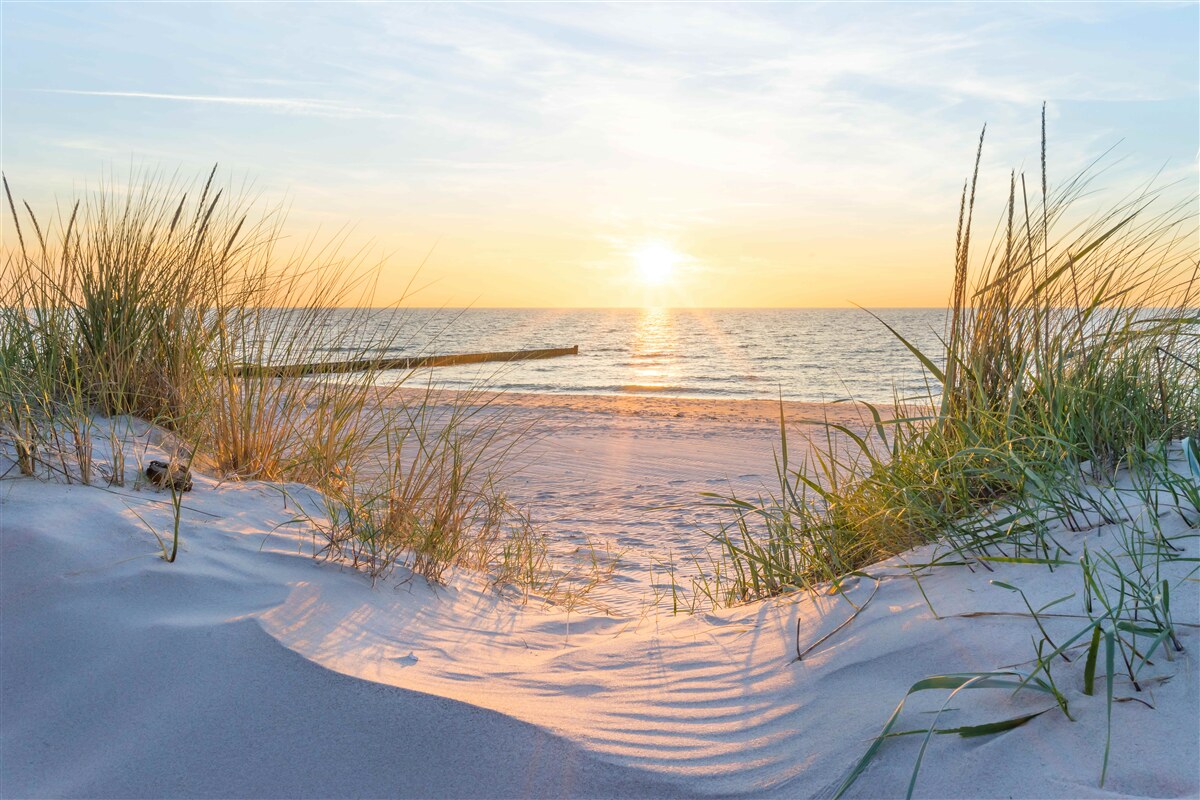Fotobehang zonsondergang op het strand