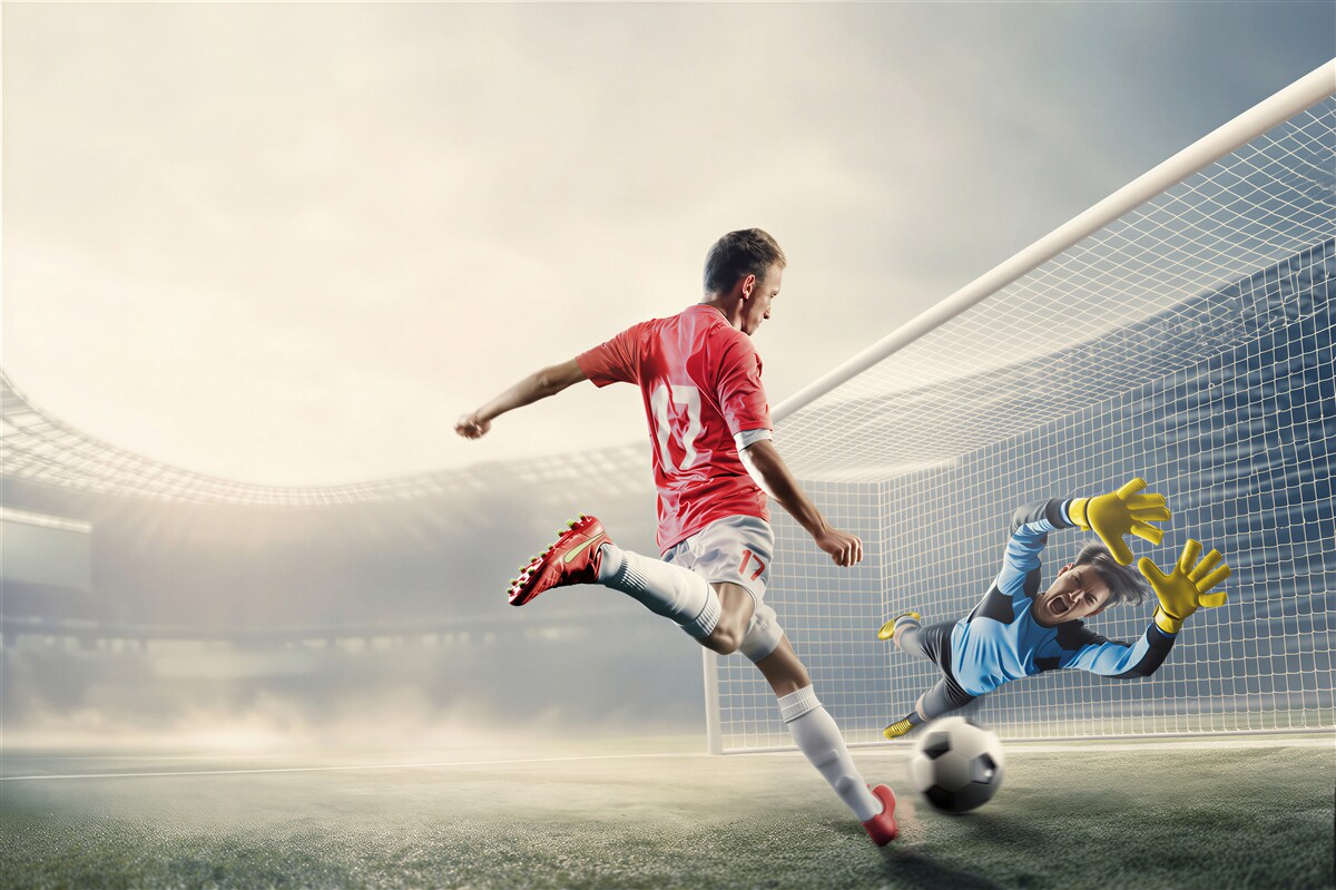 Fotobehang voetballer die op doel schiet