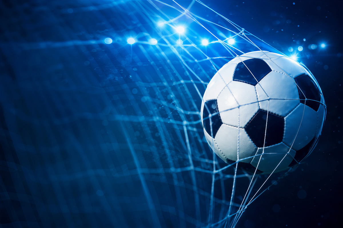 Fotobehang concentreer je op de voetbal in het doel